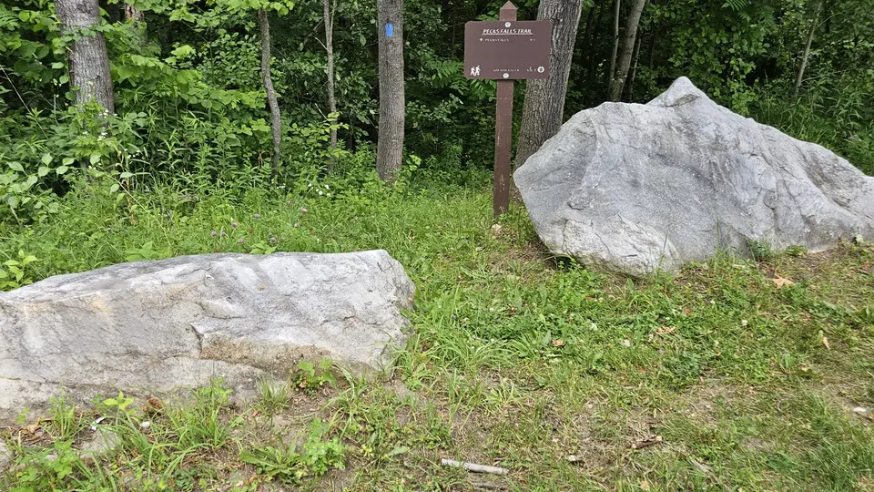 The 24'' gap in rocks by the trailhead.