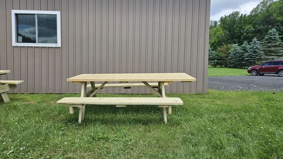 An accessible picnic table by the Barn