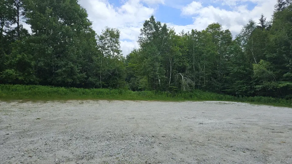 The large gravel parking lot.