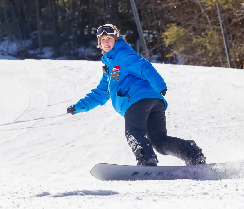 A snowboarder descends a slope at Ski Butternut