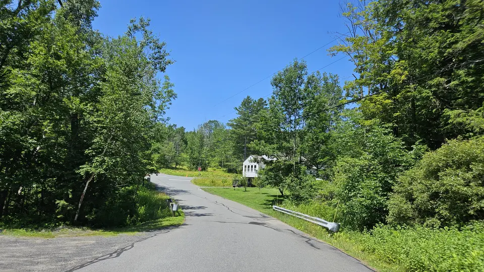 The road leading to the parking lot.