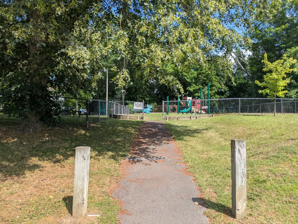 Path leading to playground from street. 
