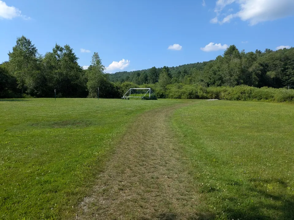 The gravel trail gets overgrown with grass at points