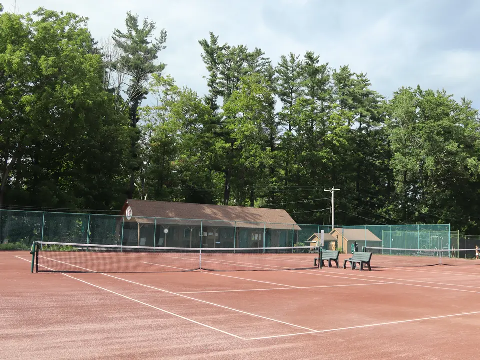 View of the Wyantenuck Country Club tennis courts. The club offers 5 red-clay courts which feature clinics, lessons and a junior program. 