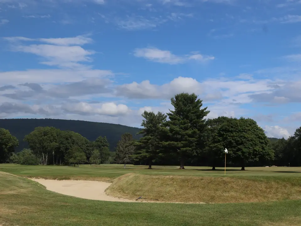 View of Hole 18 on Wyantenucks’ golf course, with views of the Berkshires in the background.