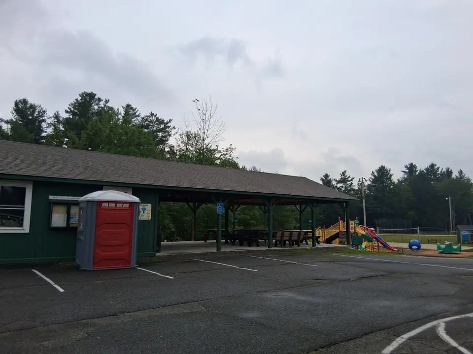 Parking area for Becket Center Town Park, which includes accessible parking and a portable restroom.