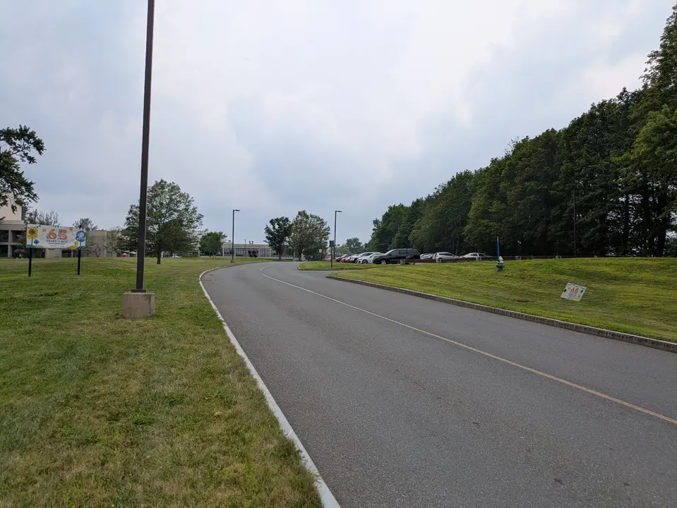 Entrance road leading to visitor parking lot