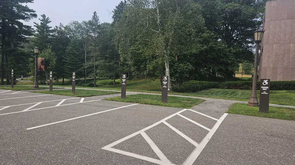 The 8 handicap parking spaces by the Clark.