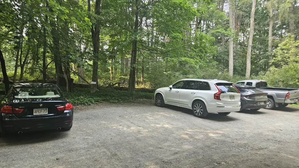 The flat gravel parking lot.