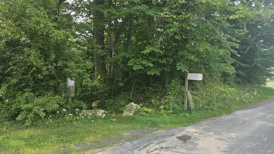 The trailhead for the path that leads steeply down to the launch site.