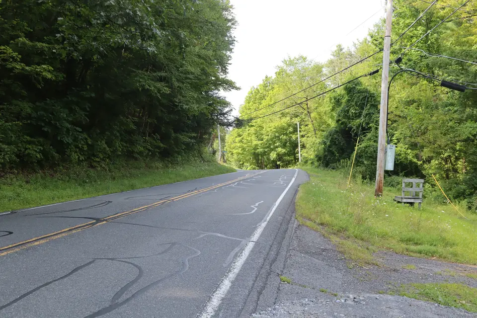 Entrance to Blue Hill Road (right) off Monument Valley Road northbound. Blue Hill Road can be taken to the start of Myrin Preserve. Parking is avaliable on the shoulder, where this photo was taken.
