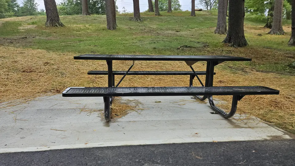 An accessible picnic table along the path.