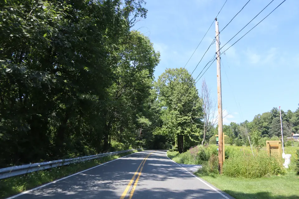 Access to the parking area to Tom Ball Mountain (right) off Alford Road, facing northwest.